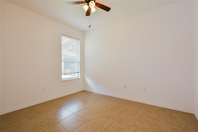 spare room featuring light tile patterned floors and ceiling fan