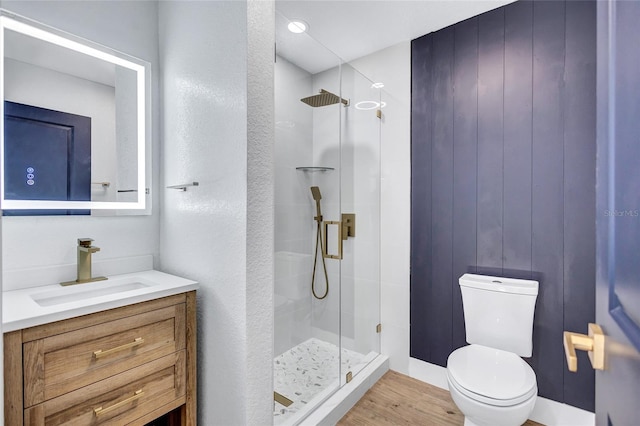 bathroom with vanity, toilet, and walk in shower