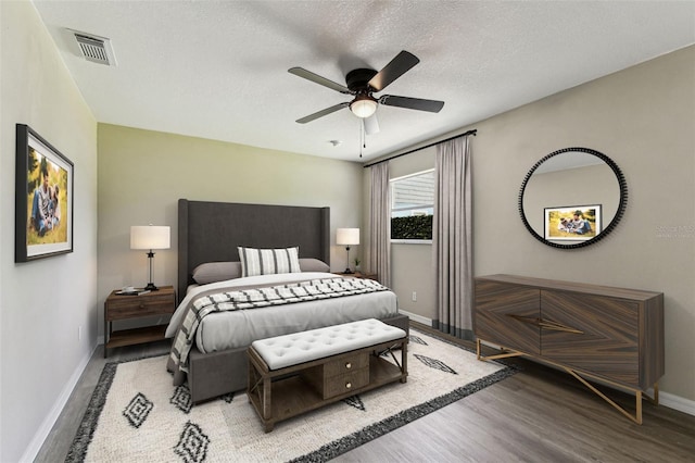 102 Shore Dr E, Oldsmar, FL 34677 - bedroom with wood finished floors, ceiling fan, and a textured ceiling