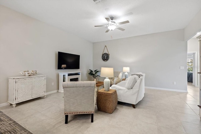 tiled living room featuring ceiling fan