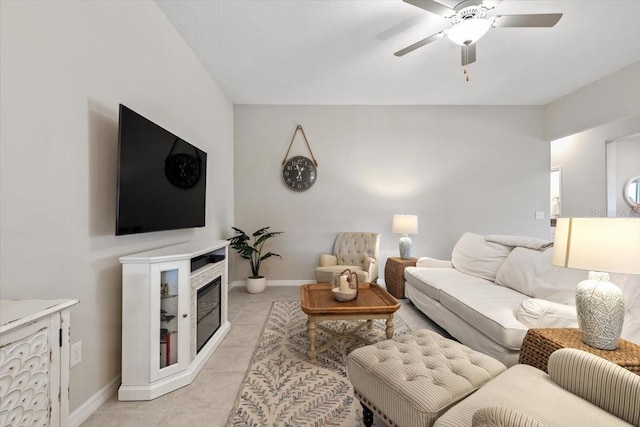 tiled living room featuring ceiling fan