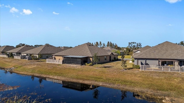 rear view of property featuring a water view