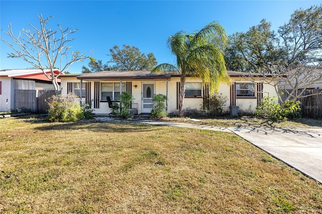 ranch-style house with a porch and a front yard