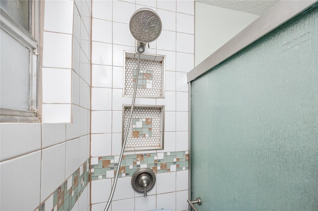 washroom featuring tile walls