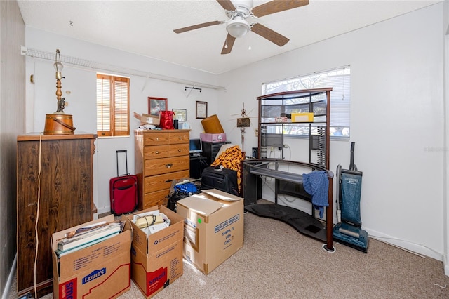 interior space with ceiling fan