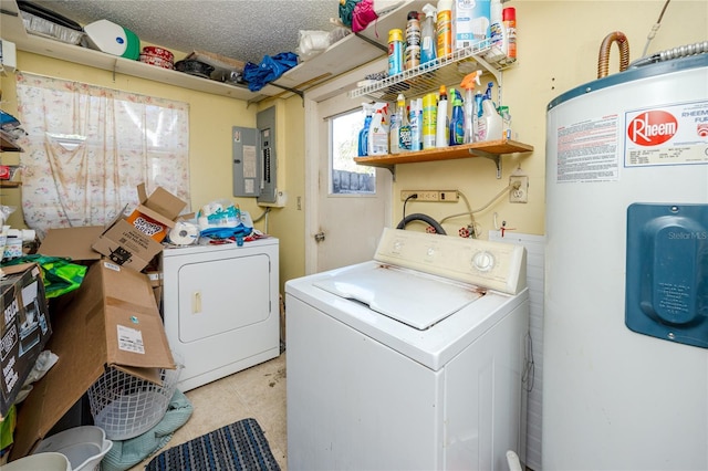 laundry area featuring washing machine and clothes dryer, electric panel, water heater, and a textured ceiling