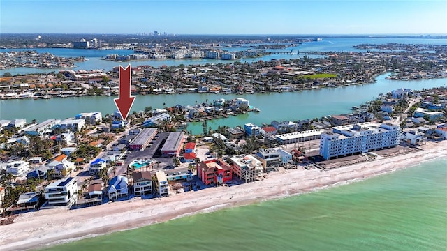 bird's eye view with a water view and a view of the beach