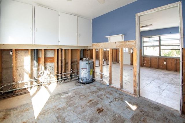 miscellaneous room featuring water heater and ceiling fan