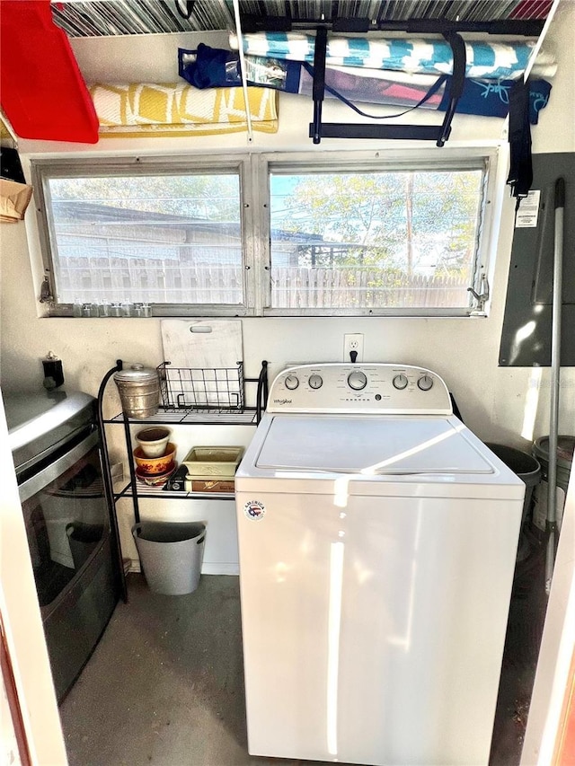 laundry room featuring plenty of natural light and washer / dryer