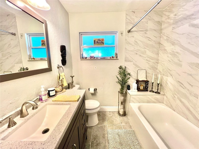 full bathroom featuring vanity, toilet, and tiled shower / bath