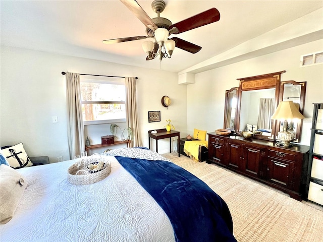 bedroom featuring ceiling fan and lofted ceiling