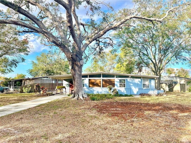 ranch-style home featuring a carport