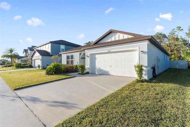 view of front facade with a garage and a front lawn