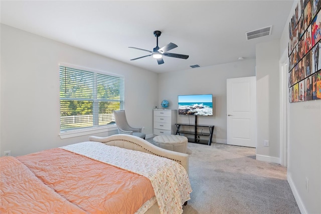 bedroom featuring light carpet and ceiling fan