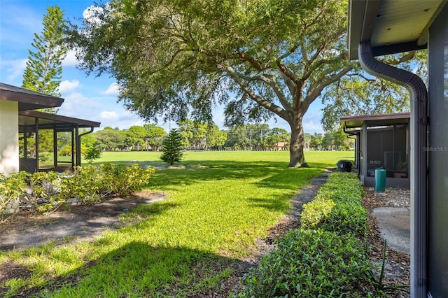 view of yard with a sunroom