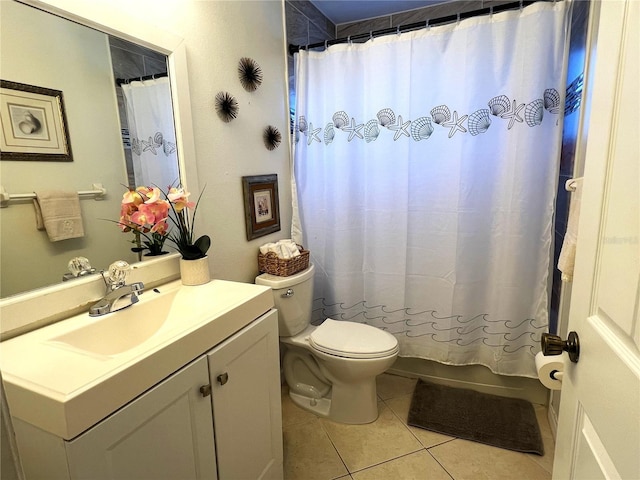 bathroom with tile patterned floors, toilet, vanity, and a shower with shower curtain