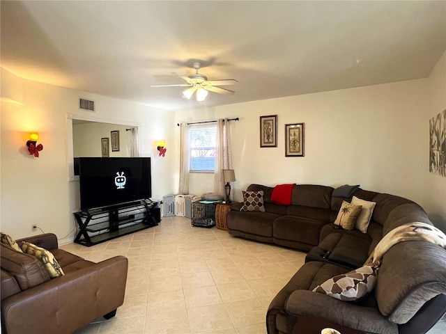 tiled living room featuring ceiling fan