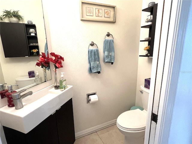 bathroom featuring tile patterned flooring, vanity, and toilet