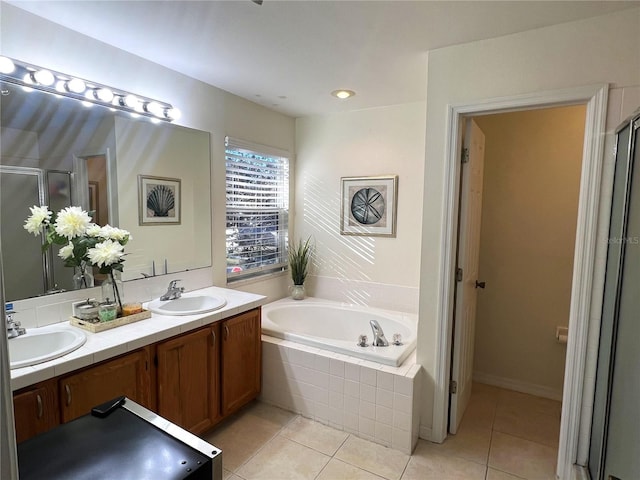 bathroom featuring vanity, tile patterned floors, and separate shower and tub