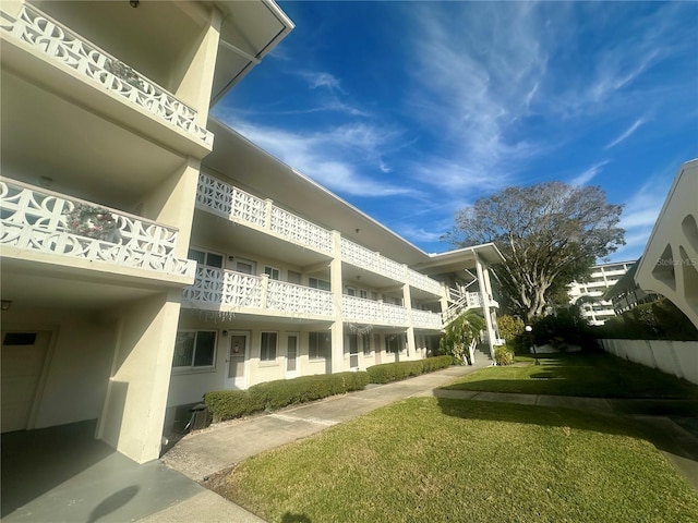 view of home's community with a lawn