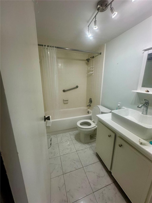 full bath with marble finish floor, shower / bath combination, vanity, and toilet