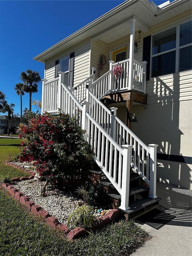 view of side of home with covered porch