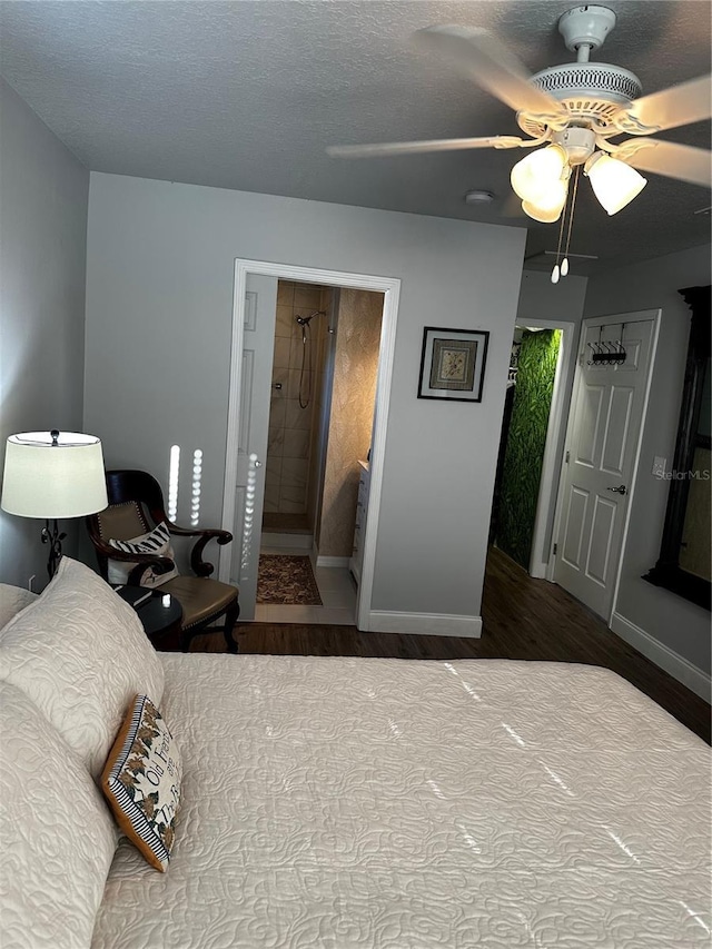 bedroom with ceiling fan, a textured ceiling, and hardwood / wood-style flooring