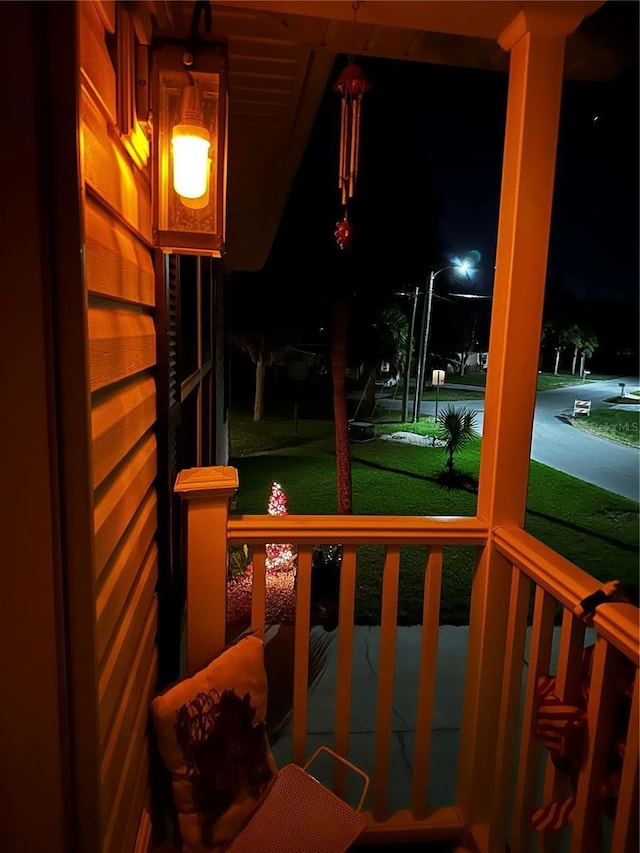 yard at night with a porch