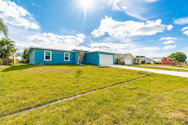 ranch-style home with a front yard and a garage