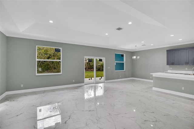 unfurnished living room featuring ornamental molding