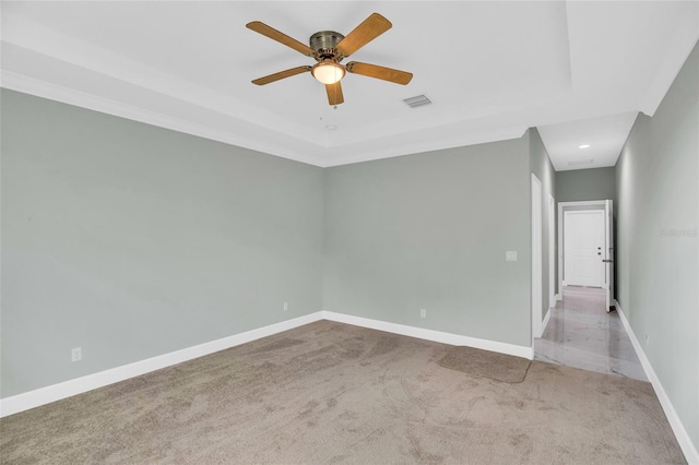 empty room featuring ceiling fan and light colored carpet