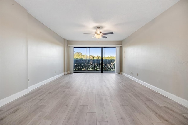 unfurnished room with light wood-type flooring and ceiling fan