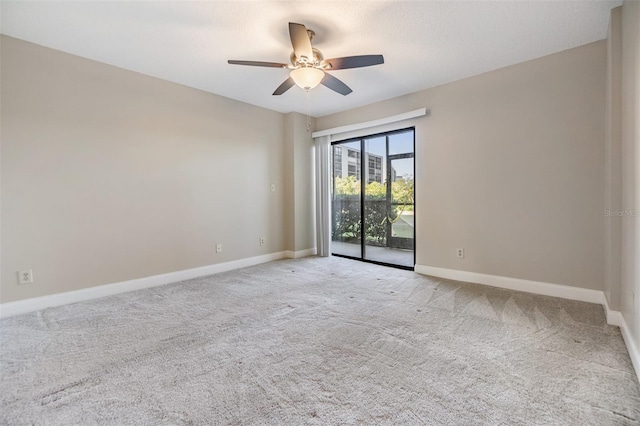 unfurnished room with ceiling fan and light colored carpet