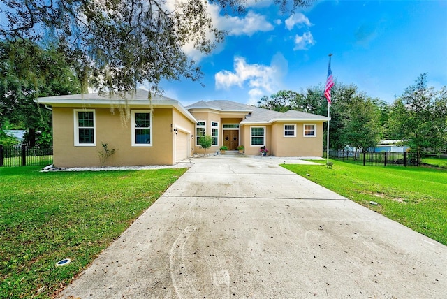 view of front facade with a garage and a front yard