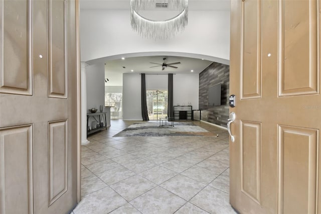 entryway featuring ceiling fan and light tile patterned floors