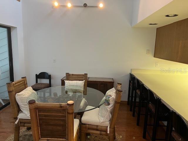 dining area with dark hardwood / wood-style floors