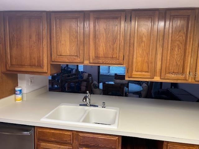 kitchen with stainless steel dishwasher and sink