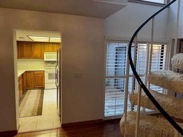 interior space with hardwood / wood-style floors and stove