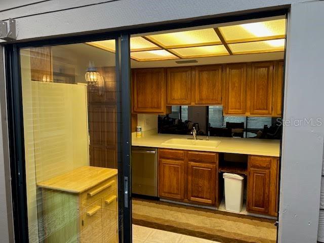 kitchen with sink and stainless steel dishwasher