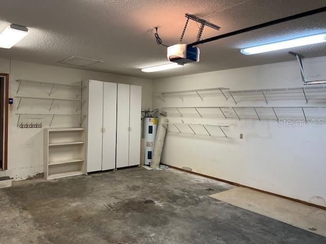 garage with electric water heater and a garage door opener