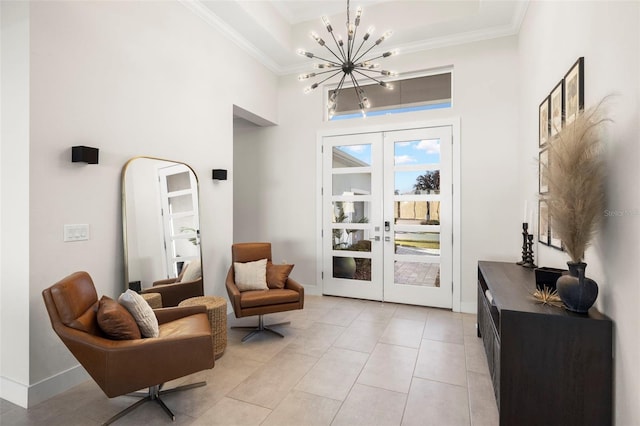 sitting room featuring crown molding, a notable chandelier, and french doors