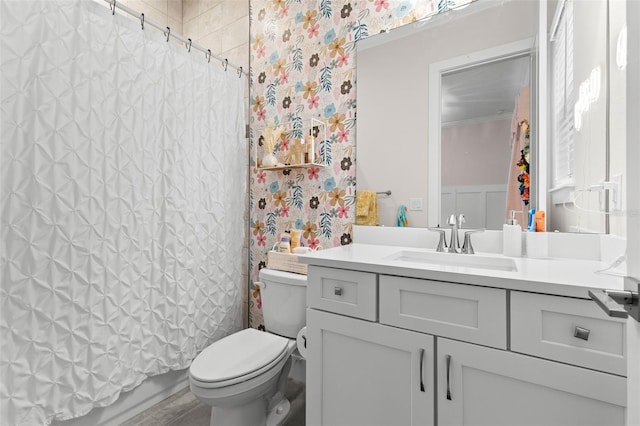 full bathroom featuring vanity, toilet, and shower / bath combo with shower curtain