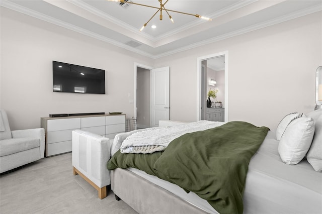 bedroom with crown molding, ensuite bath, a tray ceiling, and an inviting chandelier