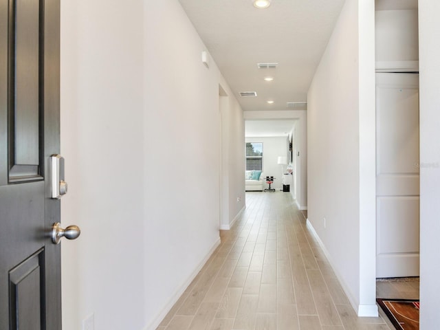 hall featuring light hardwood / wood-style flooring