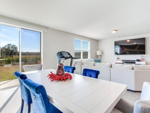 dining area featuring light tile patterned flooring