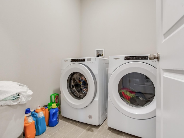 laundry room featuring washing machine and clothes dryer