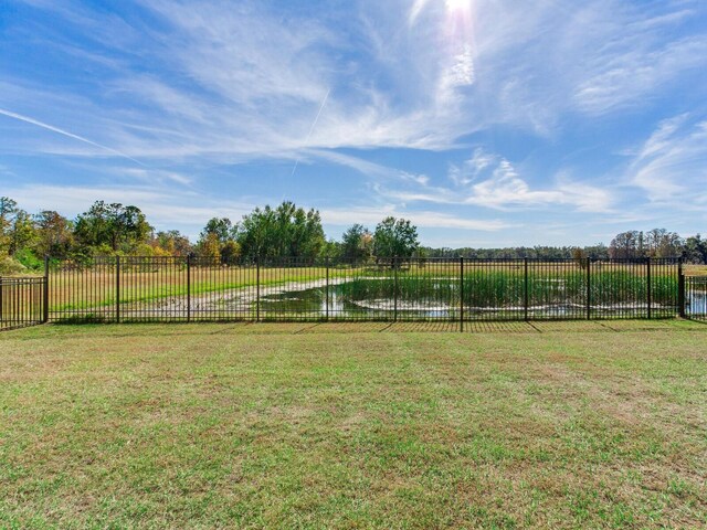 view of yard with a rural view