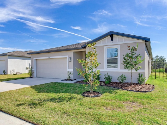 single story home featuring a front lawn and a garage