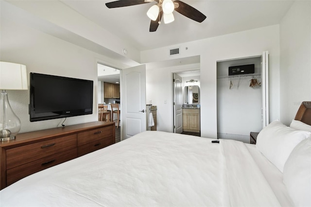 bedroom featuring ceiling fan, a closet, and ensuite bathroom