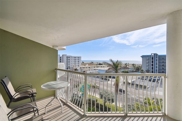 balcony featuring a water view